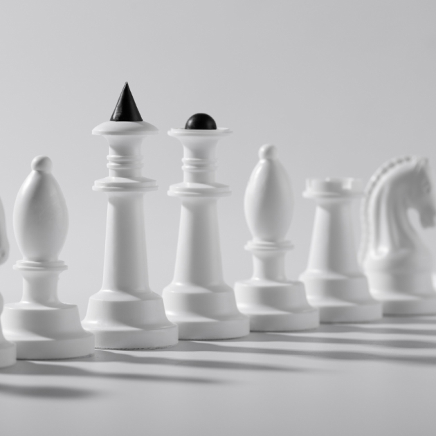 White chess pieces arranged to illustrate investment strategy